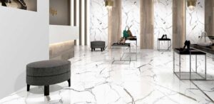 Chic boutique interior featuring marble flooring, modern furniture, and stylish accessories.